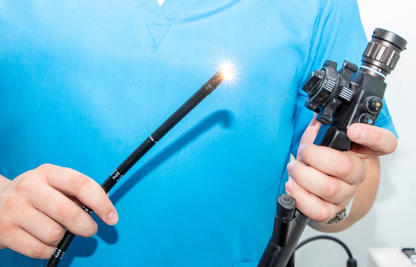 A doctor holding a gastroscope, endoscopy camera