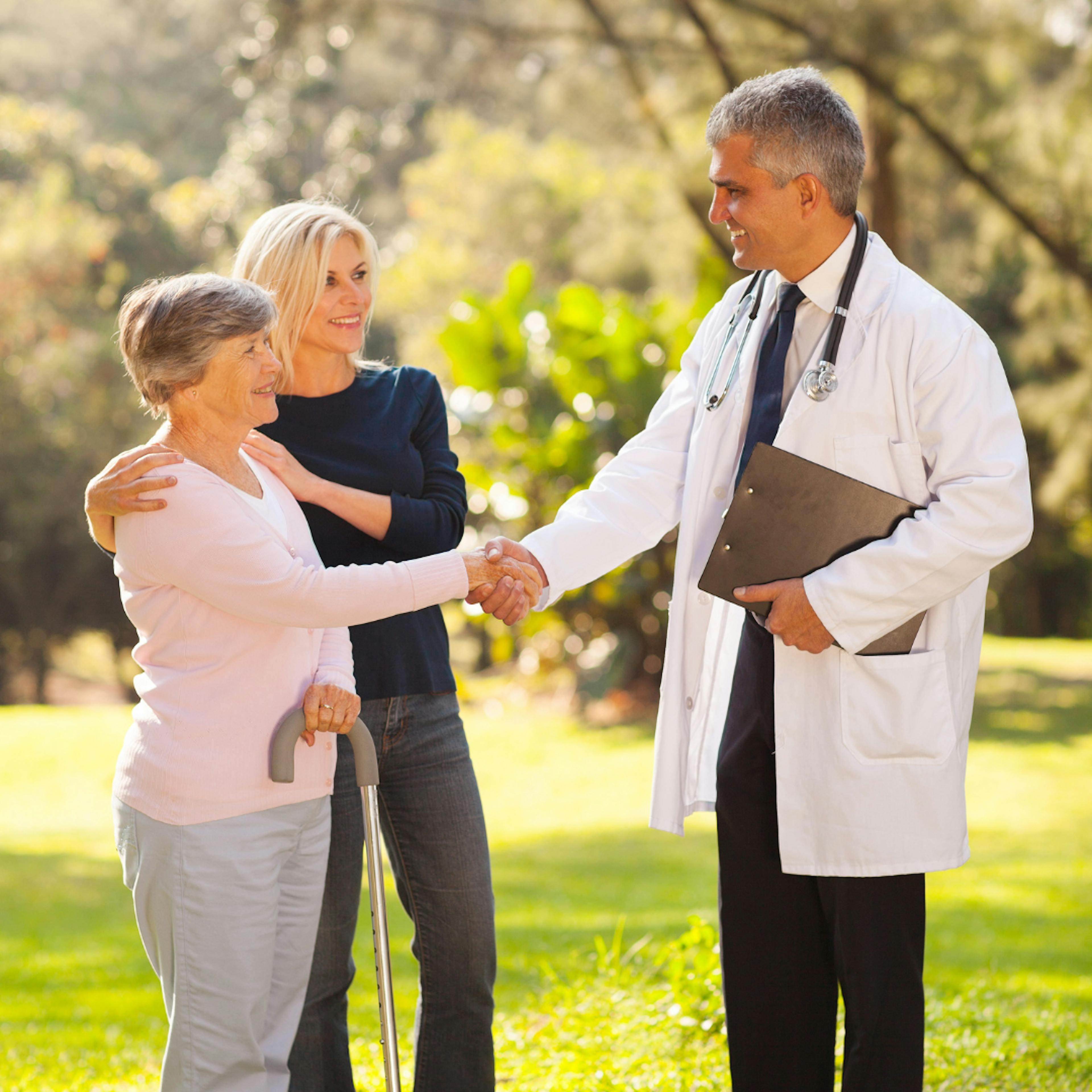 doctor shaking hands with patients