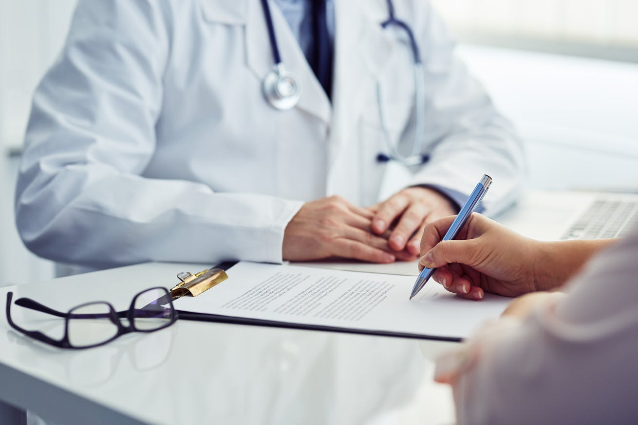 Patient filling out a form for tests