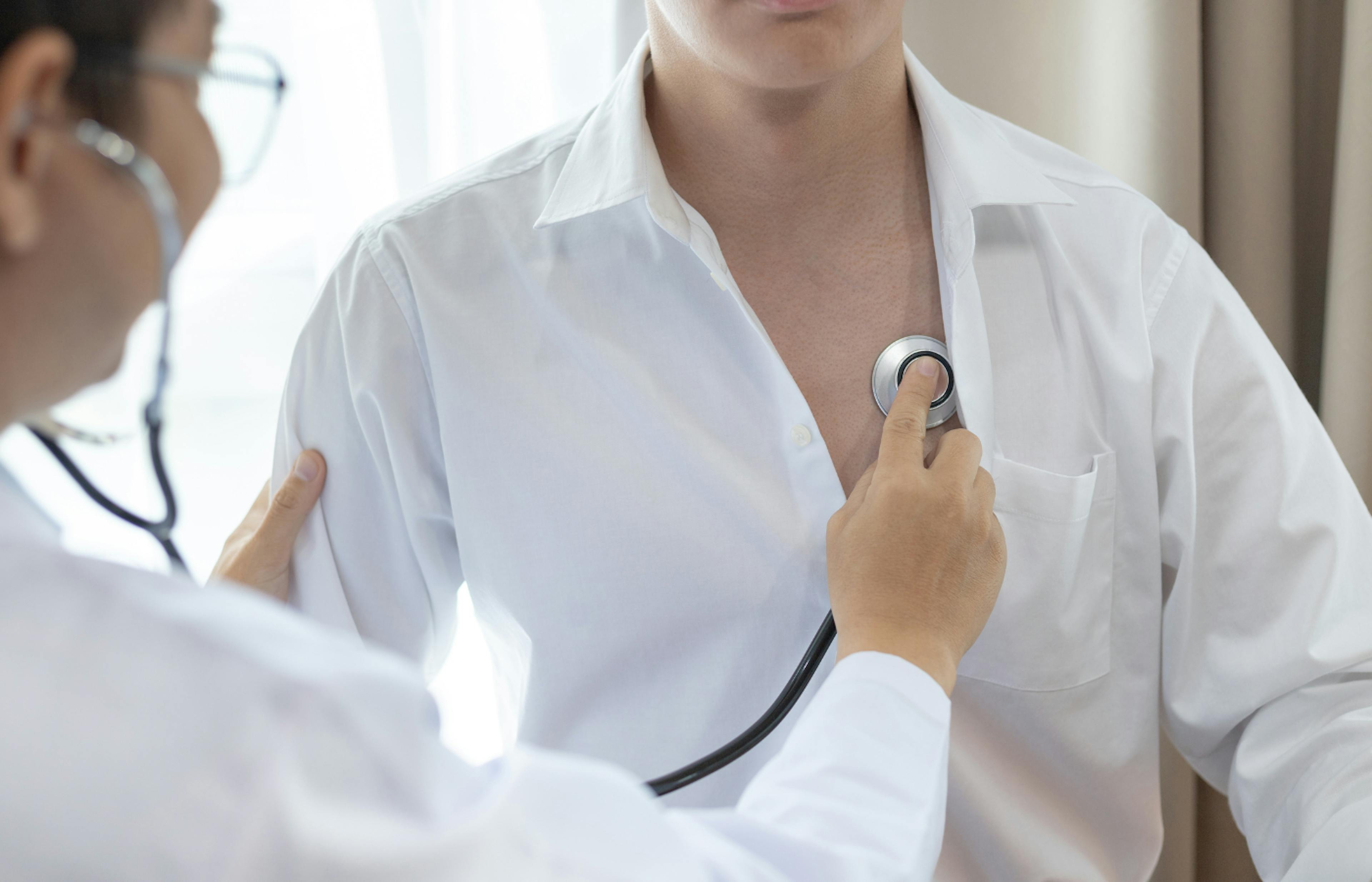 doctor examines a patient with a stethoscope