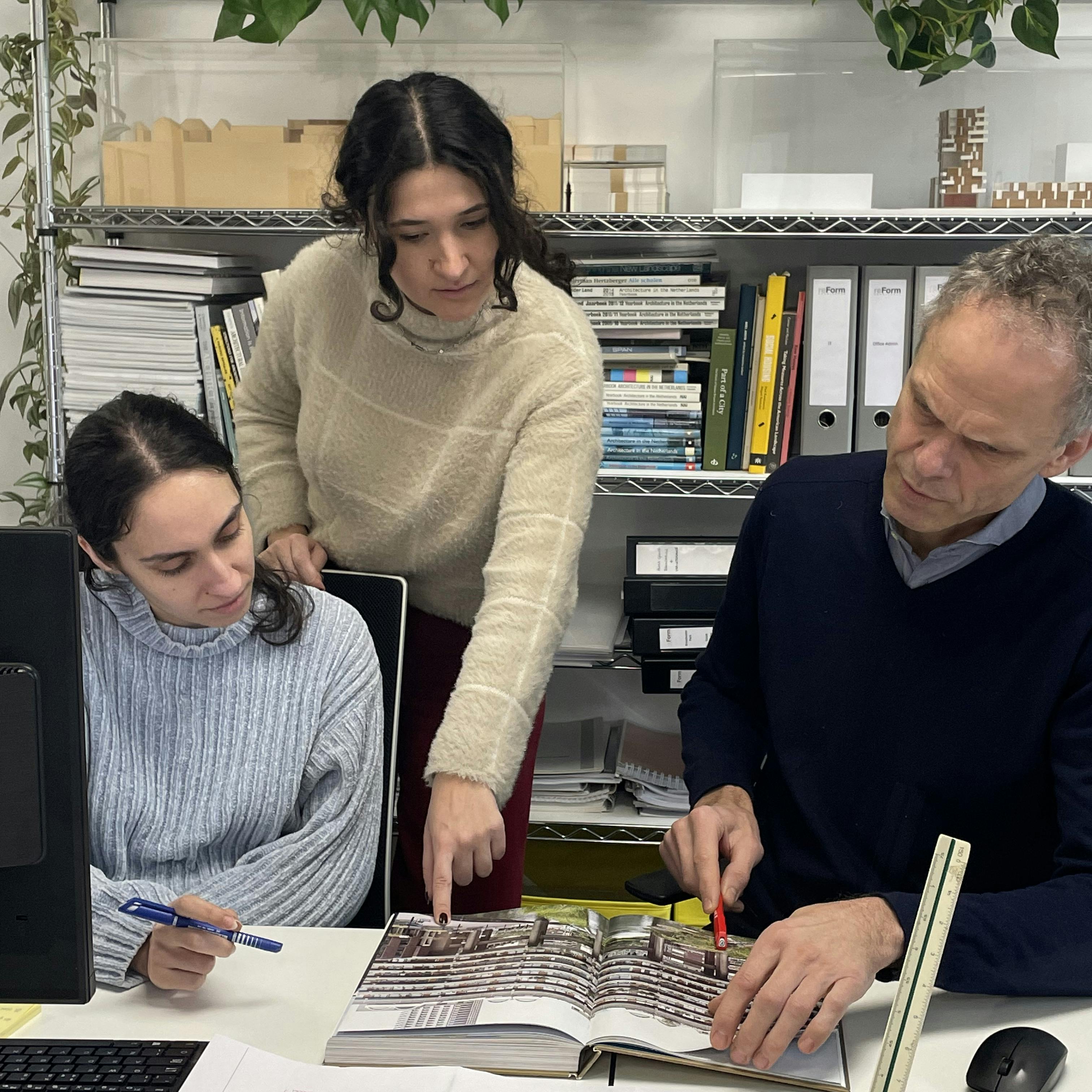 ReForm team designs on table