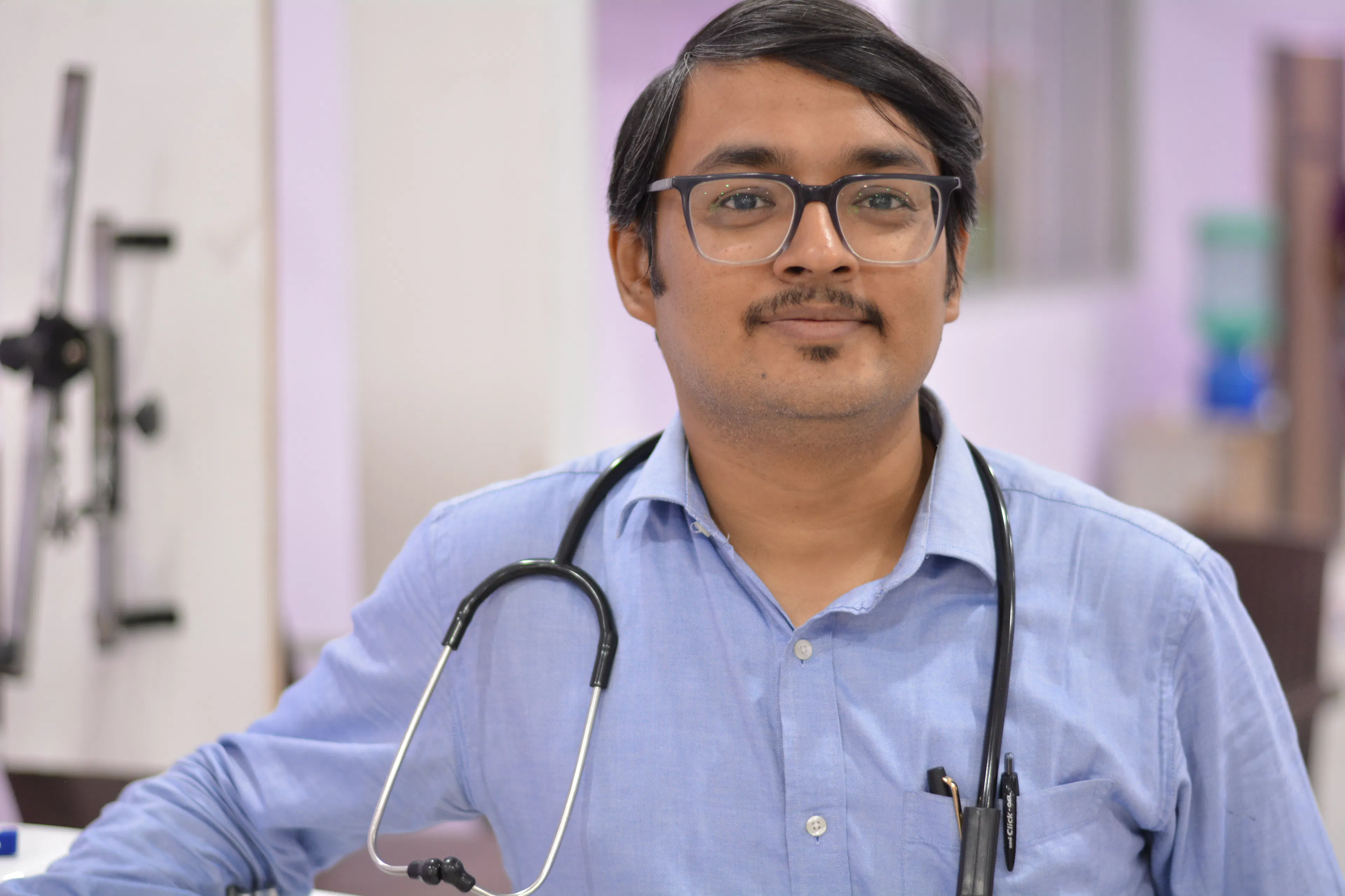 Smiling rehabilitation doctor with a stethoscope, available for safety questions during garden therapy