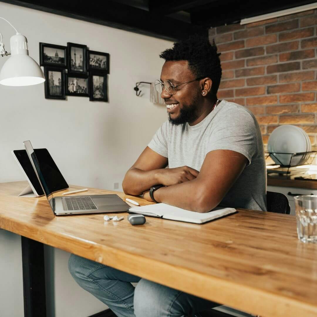 guy working from home smiling