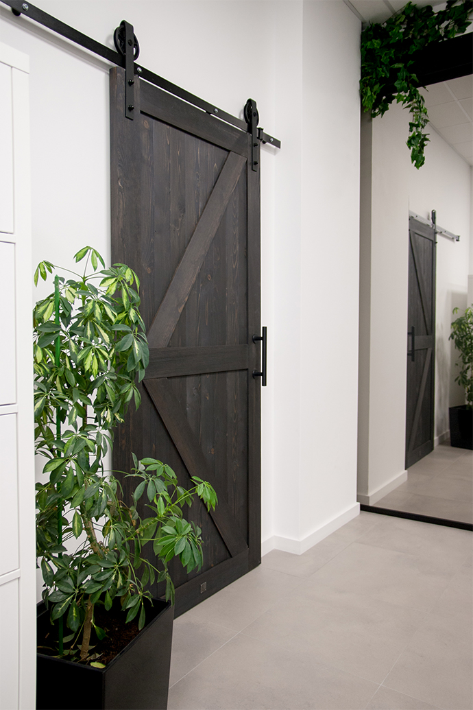 office with sliding doors, black doors, black and white interior design