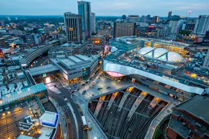 Aerial view of Birmingham city centre with New Street Station and Grand Central at dusk