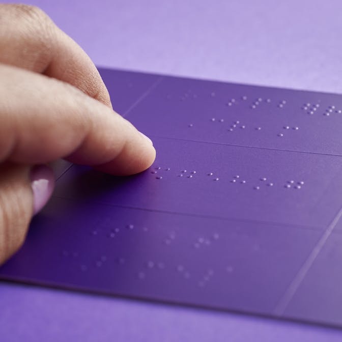 Hand reading braille