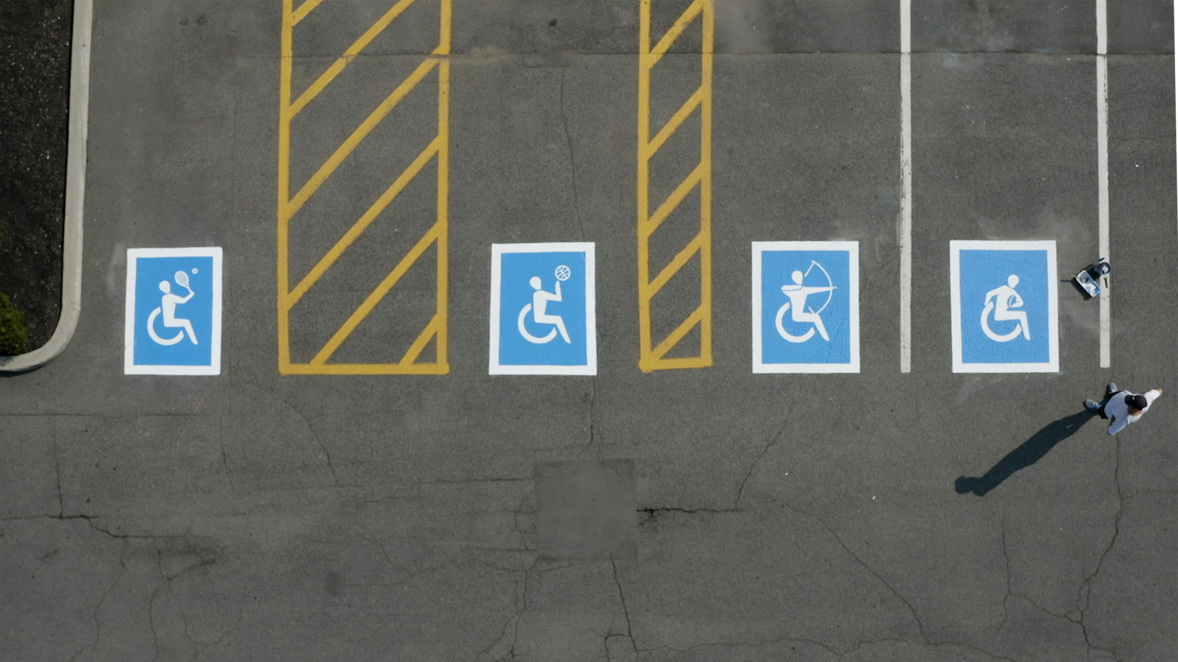 Ability signs painted on parking spaces.