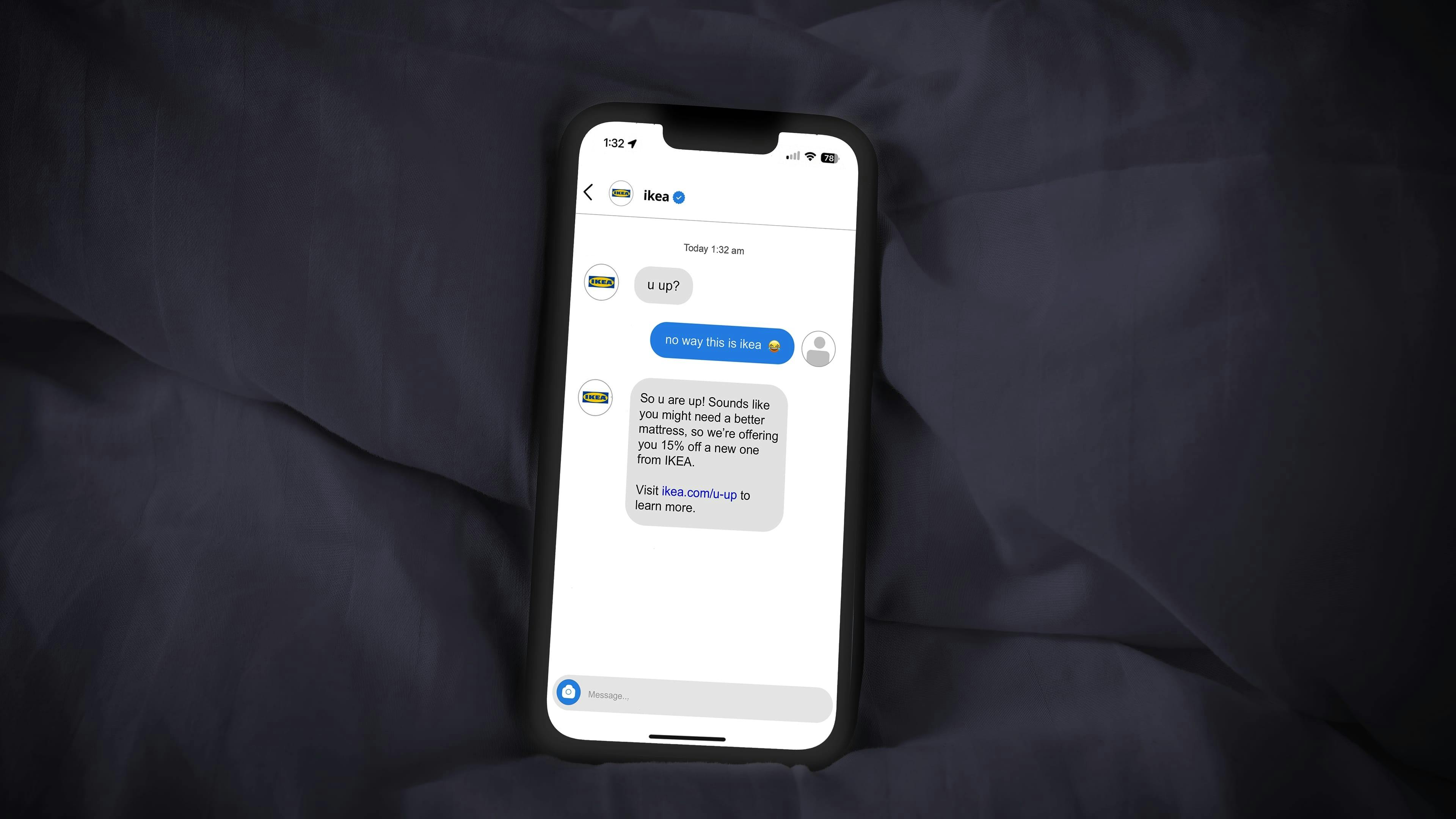 A cellphone on a plain background with the words “u up?” sent from IKEA in someone’s Instagram DMs.