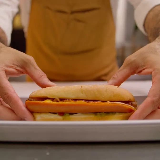 The beloved Whistle Dog is pictured on a plate.