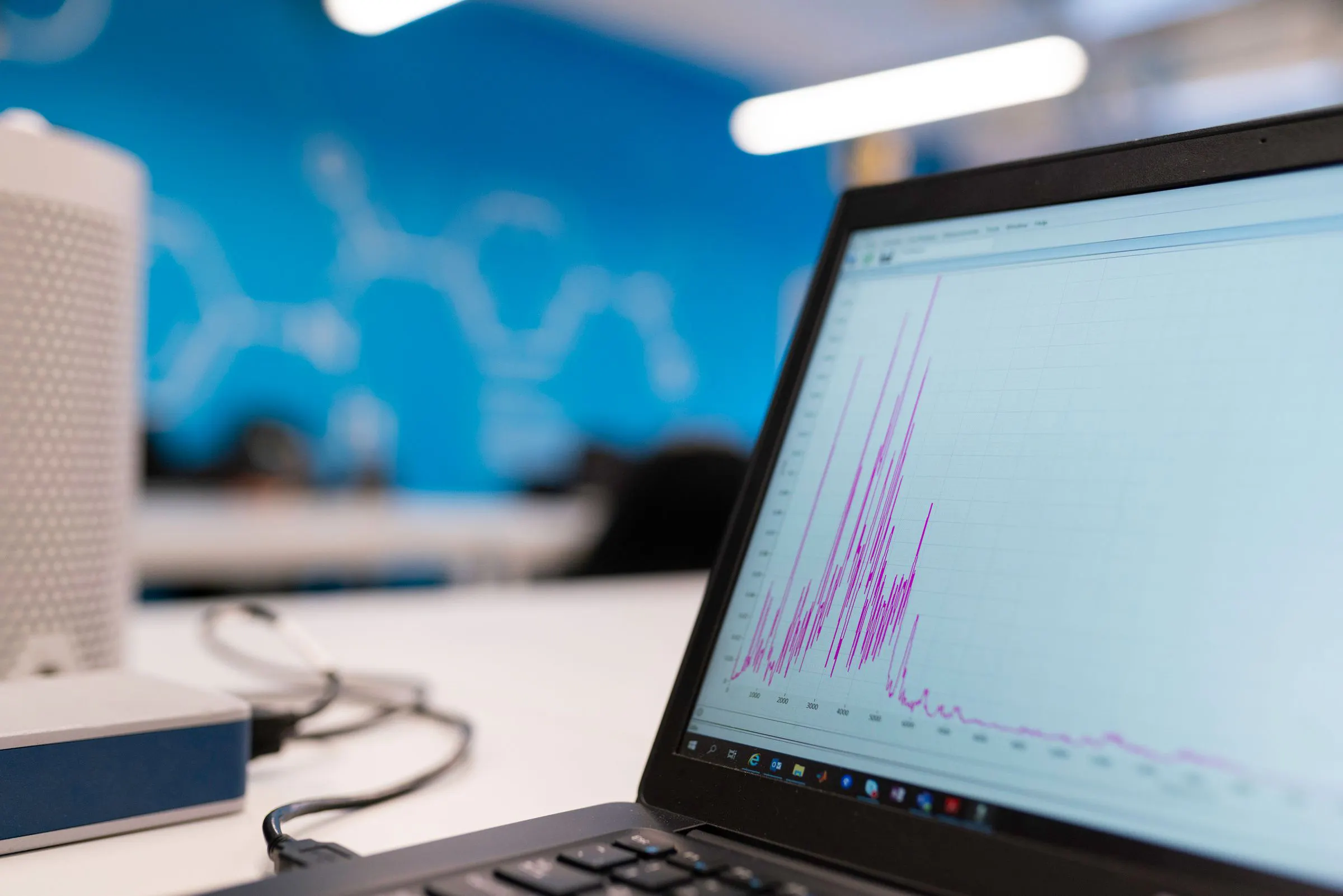 A chart on a laptop screen: queries that were flat at launch turn into spikes as the data grows.