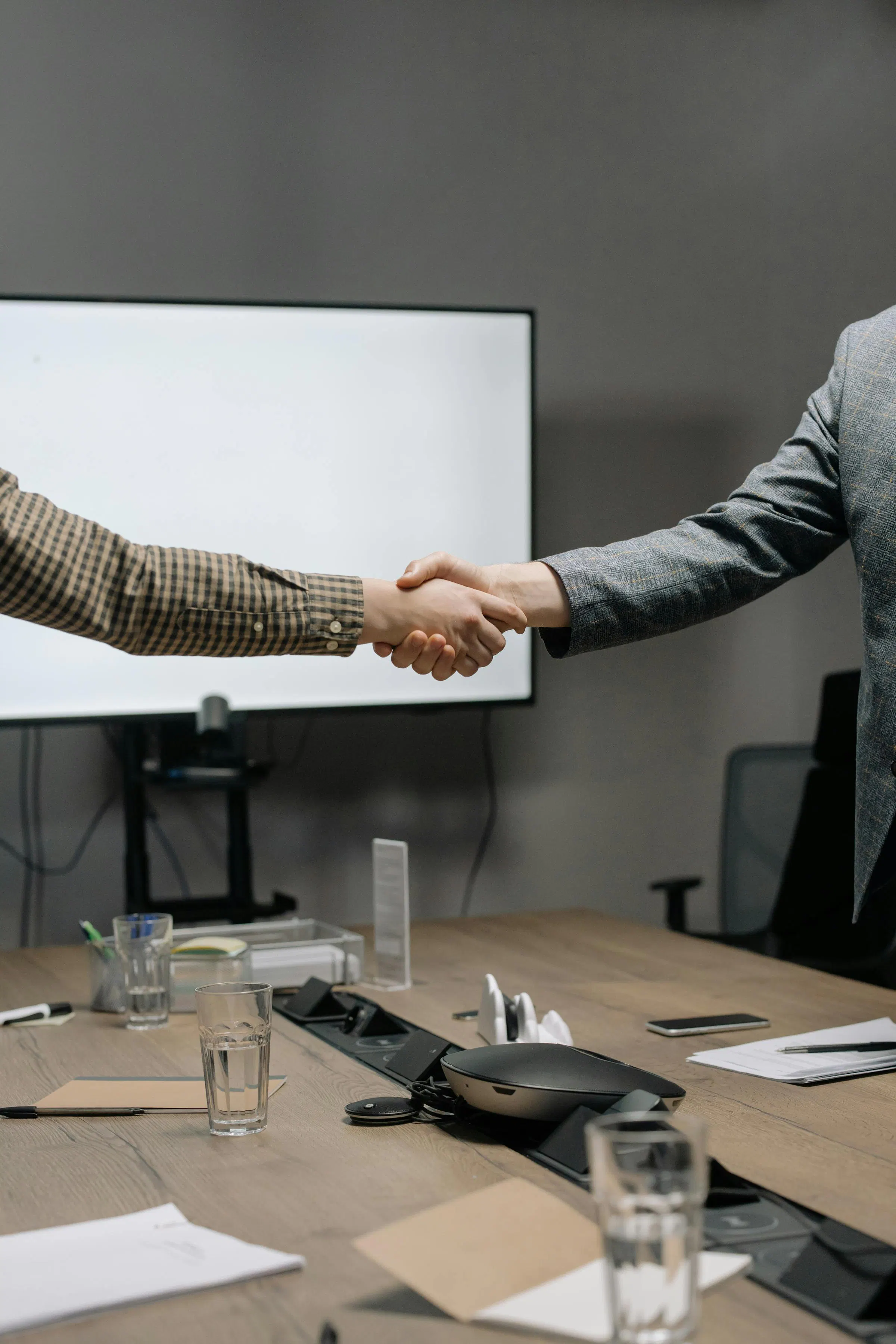 Client and squad shaking hands — without a definition of done, the handshake is theater