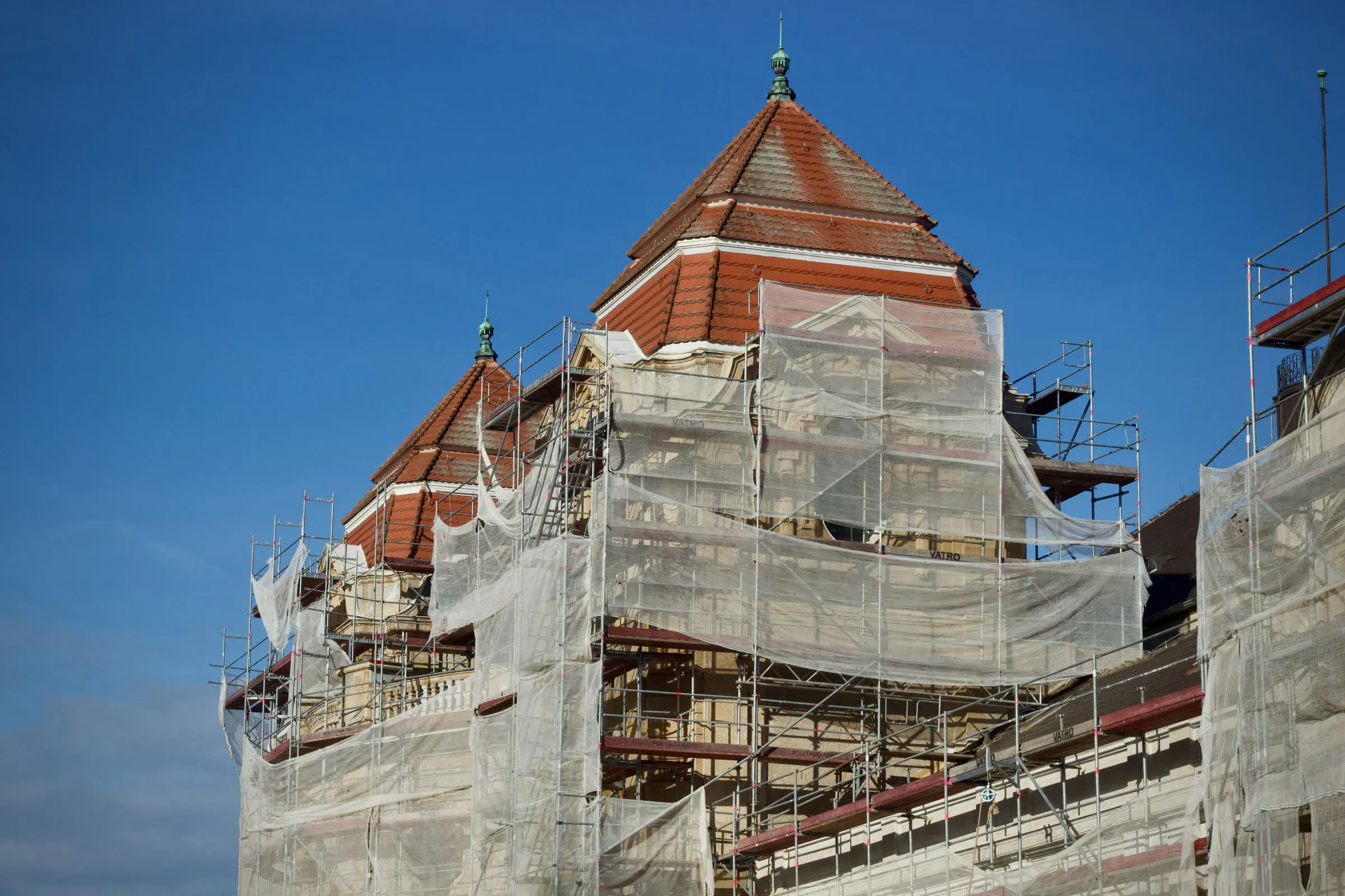 A historic building restored with scaffolding outside while life goes on inside. That is how an old codebase improves without closing its doors.