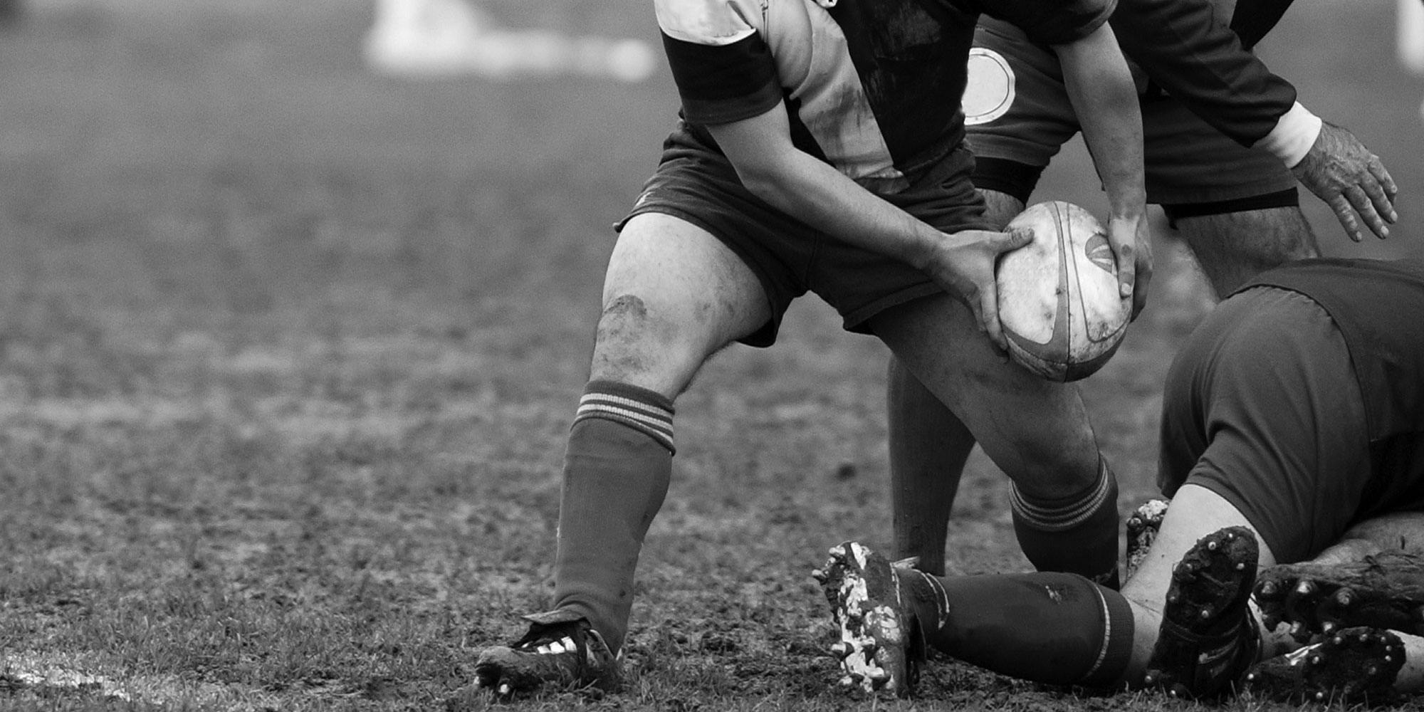 A rugby player passes the ball
