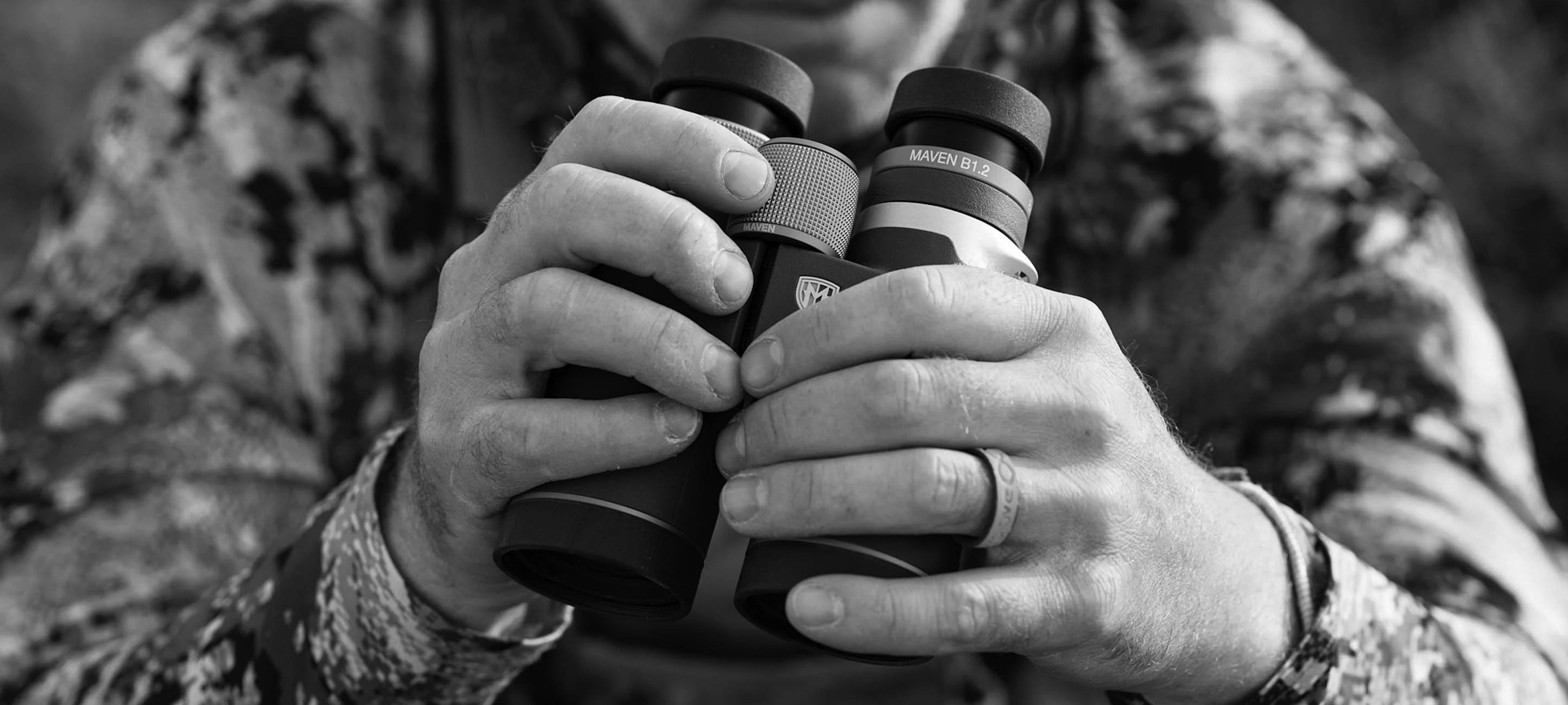 Outdoorsman holding Maven binoculars
