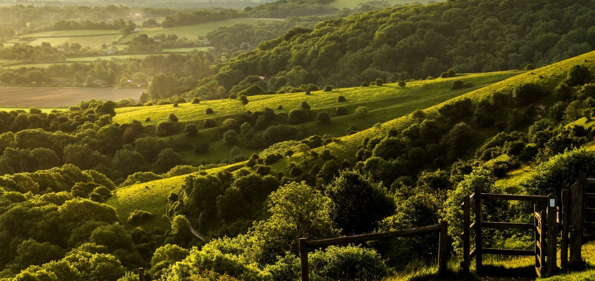 Lush green countryside landscape with rolling hills