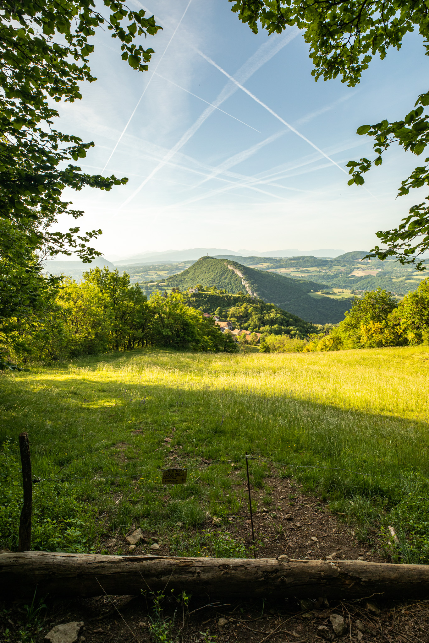 a viewpoint overlooking a valley with rolling hills in the distance