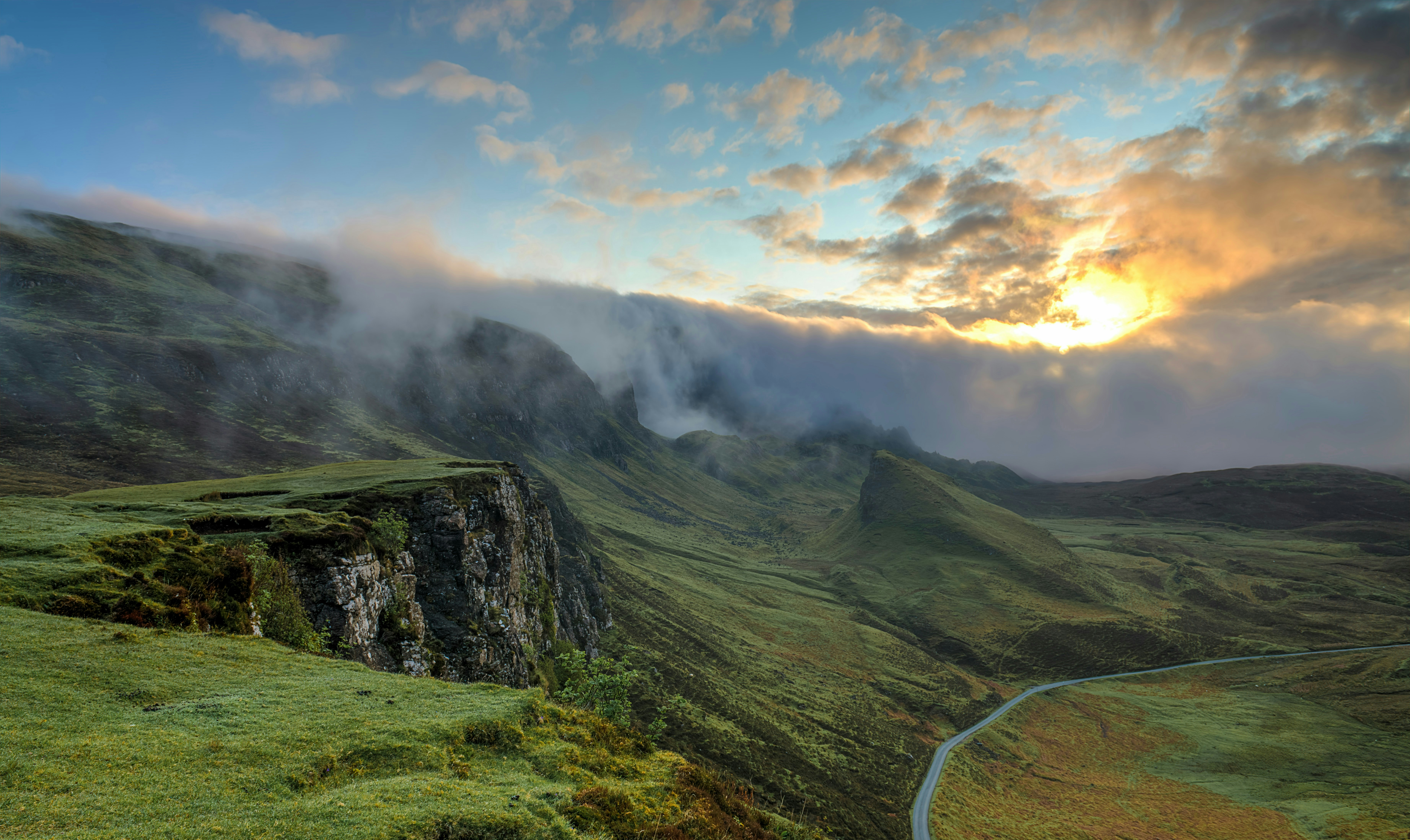 a cloud inversion in a mountainous landscape