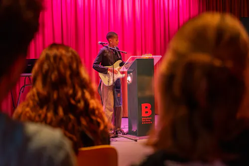 teenager playing guitar