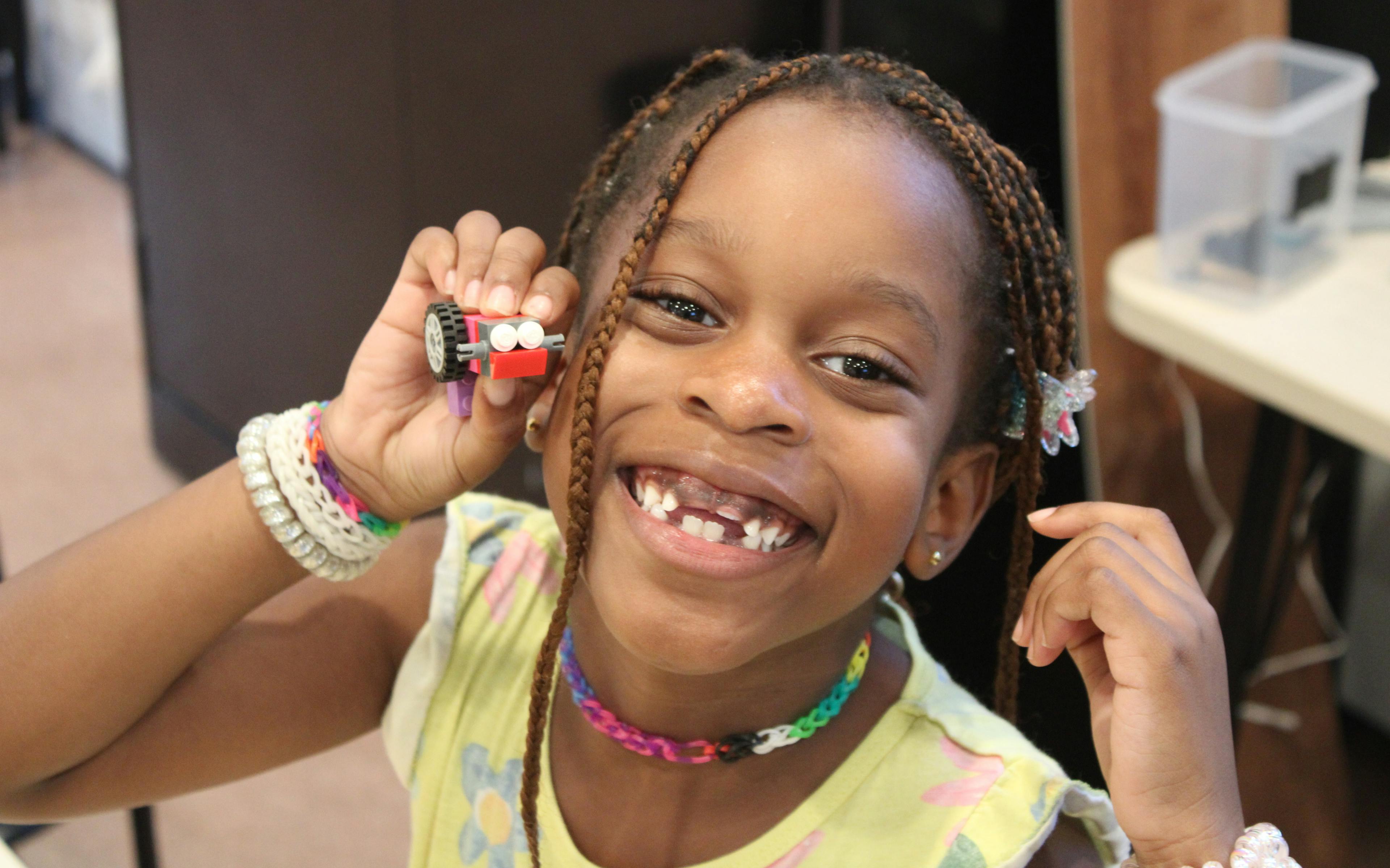 Girl playing with legos