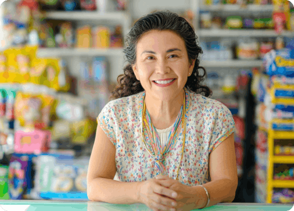 Ria agent smiling in their store
