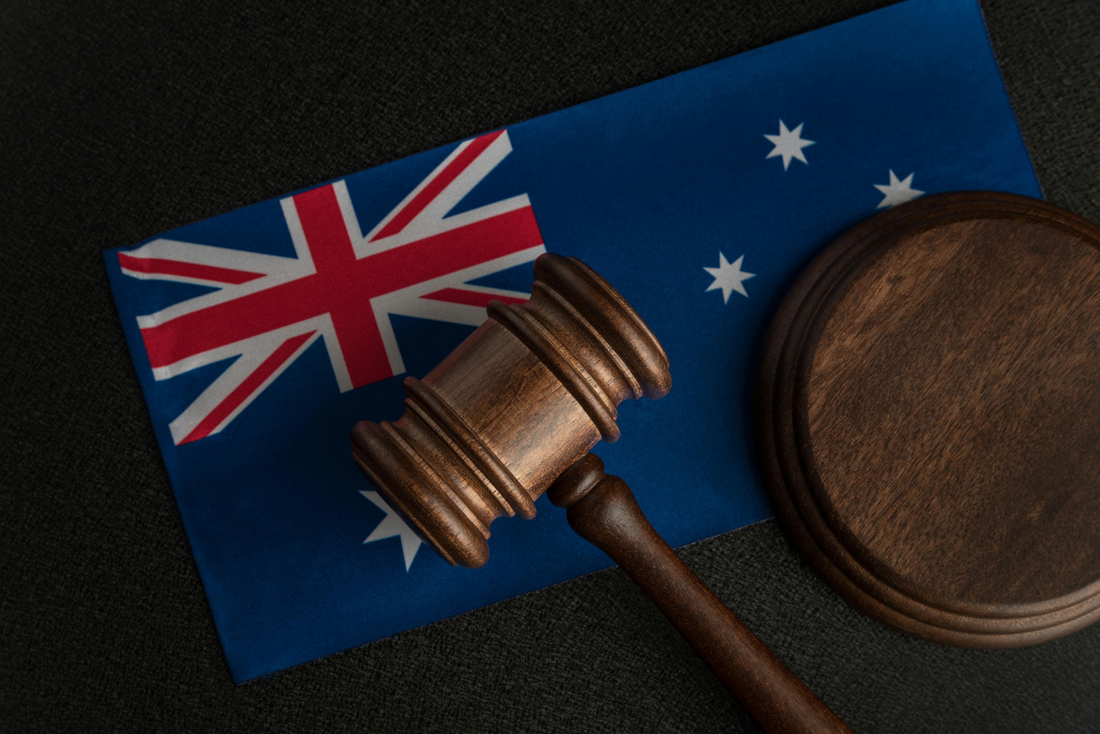 Wooden gavel on Australian flag