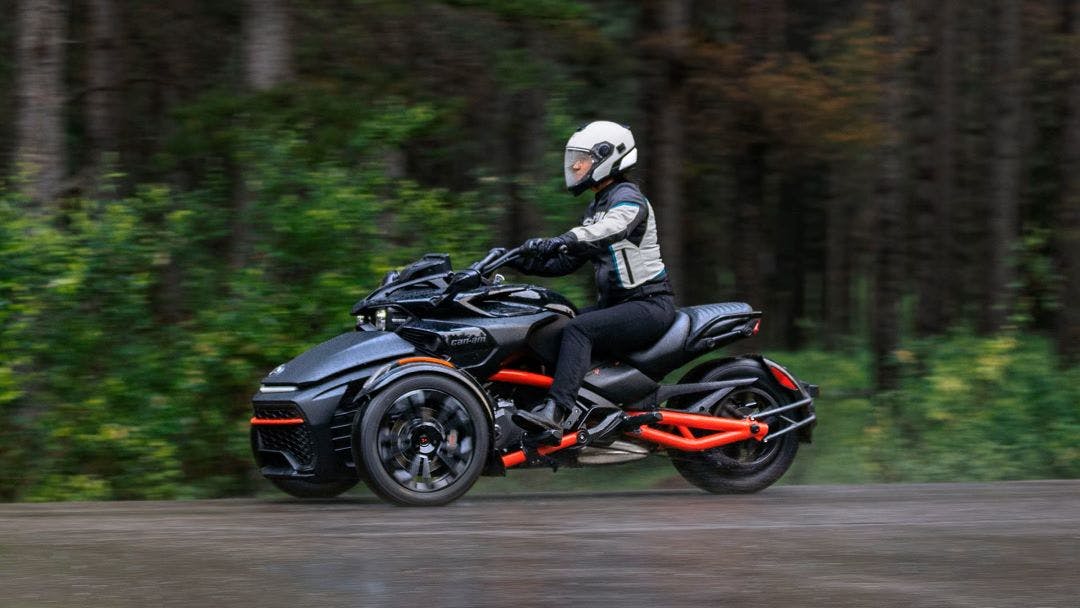 Picture of a can am spyder riding on the road comparison between can am ryker, can am spyder and polaris slingshot