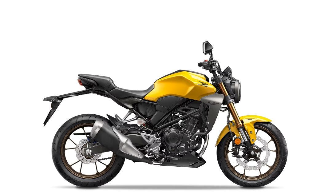 stock pic of a honda cbr300 in yellow - fuel efficient motorcycles