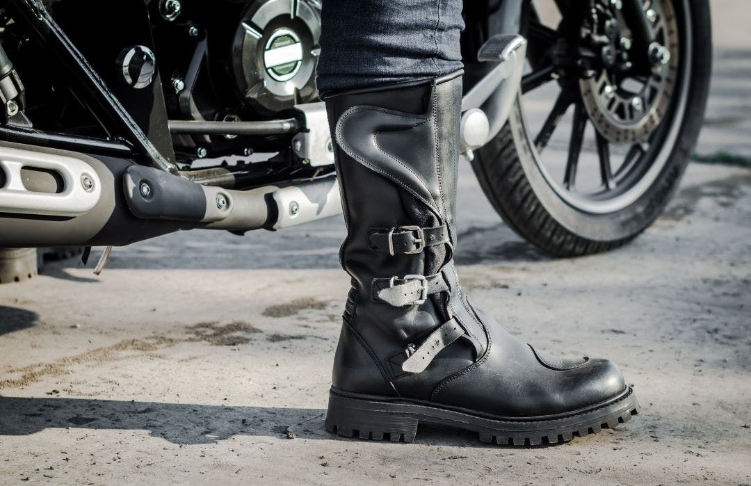 picture of a man's foot with motorcycle riding boots guide to motorcycle protective riding gear