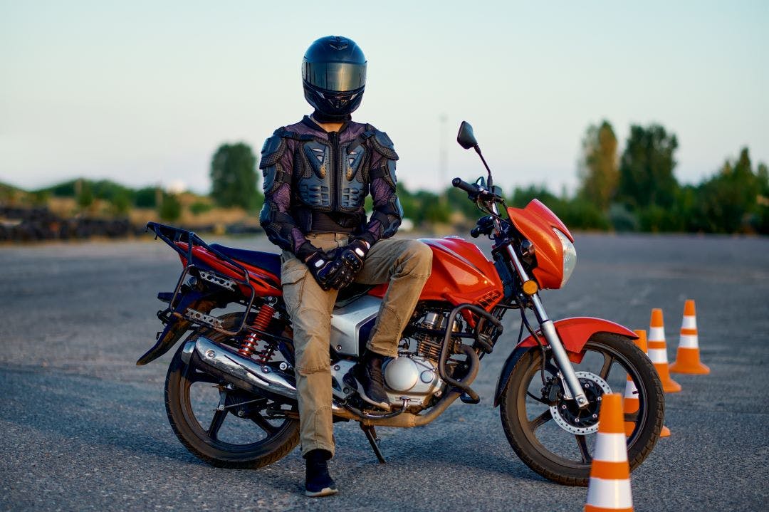 picture of a male motorcycle rider sitting on a motorcycle in a safety course california motorcycle laws