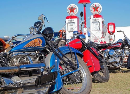 picture of some antique motorcycles and antique gas pumps from an antique motorcycle club of america meetup las vegas motorcycle clubs and meetups