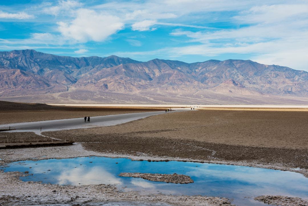 picture of badwater basin with tourists walking around road trip from las vegas to death valley