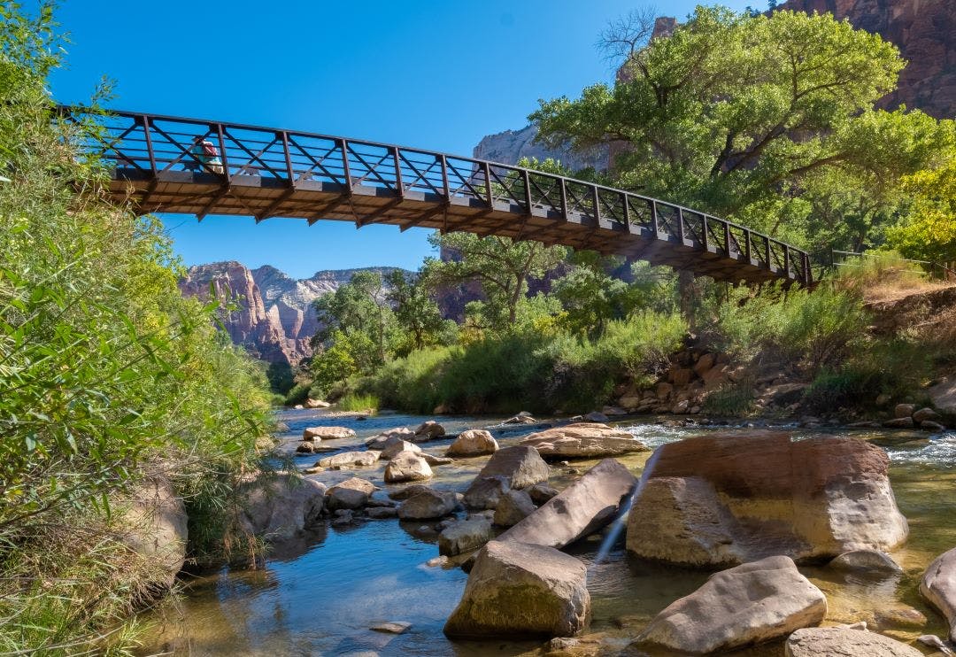 view of a walking bridge over the emerald pools trail zion national park springdale utah road trip from las vegas