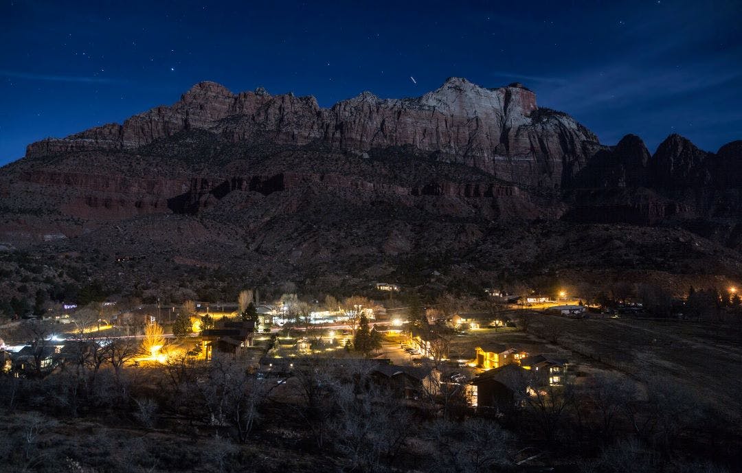 scenic picture of springdal at night with the lights and mountains in the background road trip from las vegas to zion national state park