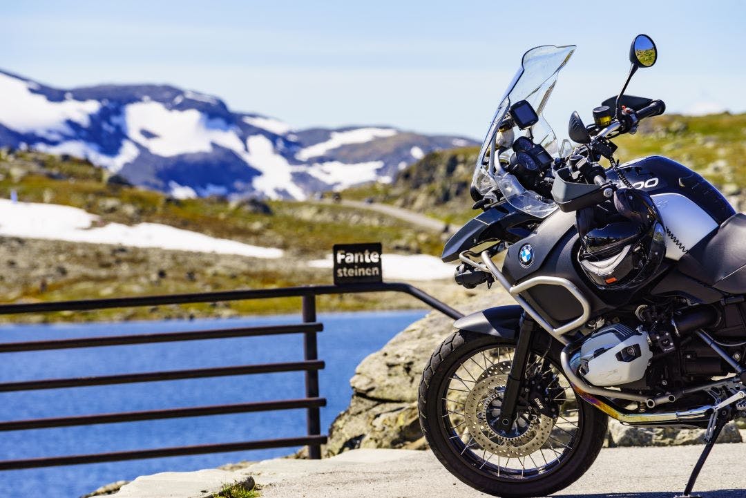 picture of bmw motorcycle parked in front of fante steinen norway do bmw motorcycles hold their values