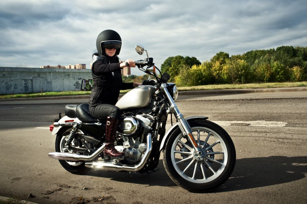 Picture of a woman on a motorcycle best motorcycles for women