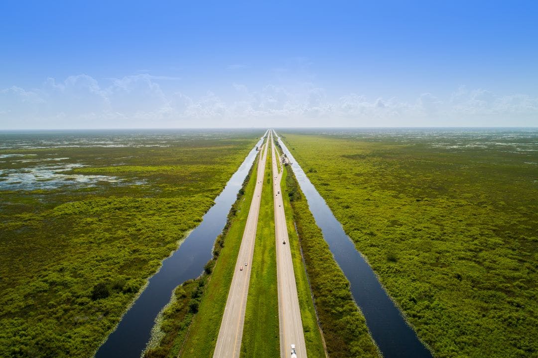Aerial view of Alligator Alley (I-75) through the Everglades in Florida scenic route for motorcycle rides in Florida