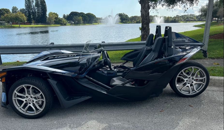 Picture of a black Polaris Slingshot SL available for rent in Florida near Miami through Riders Share