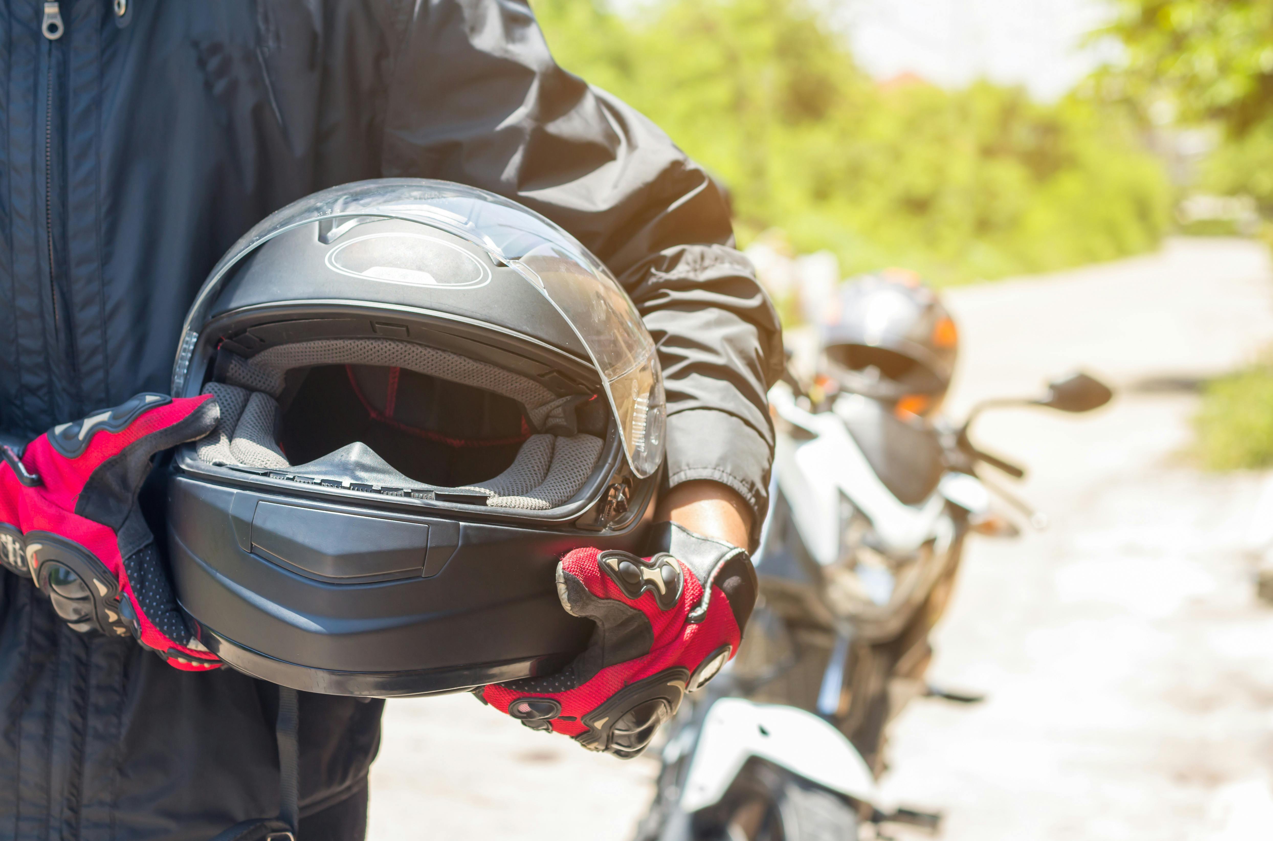 how to prevent damage to your motorcycle when you rent it; image of motorcycle rider with helmet