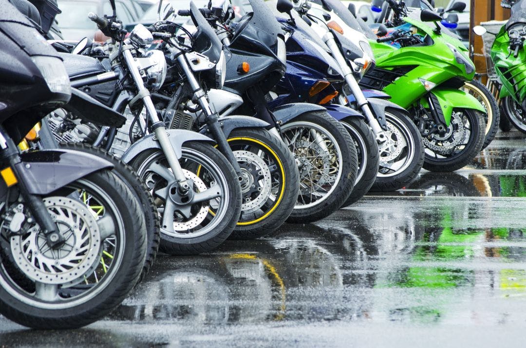 motorcycles standing in the row on asphalt closeup 14 Popular Motorcycles From the Last 10 Years