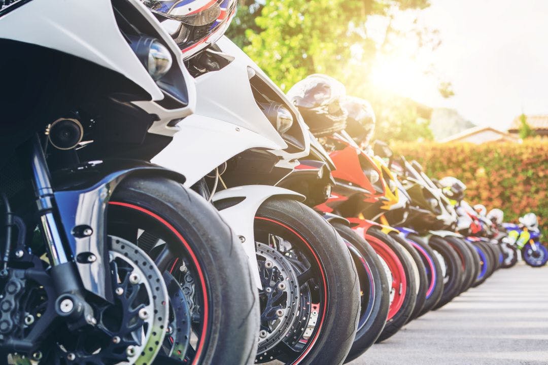 Motorcycles group parking on city street in summer List of West Palm Beach Motorcycle Clubs