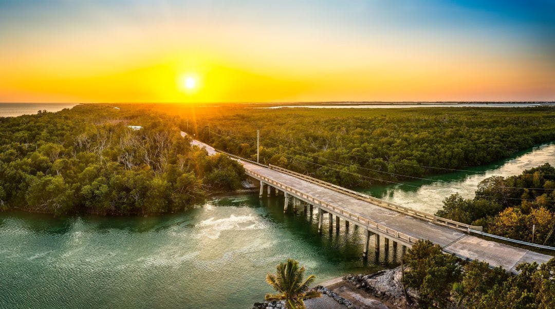 Aerial sunset with the bridge between Sugarloaf and Saddlebunch Keys, above Sugarloaf Creek, in Florida Keys, Florida Your Guide to Riding a Motorcycle in Southern Florida