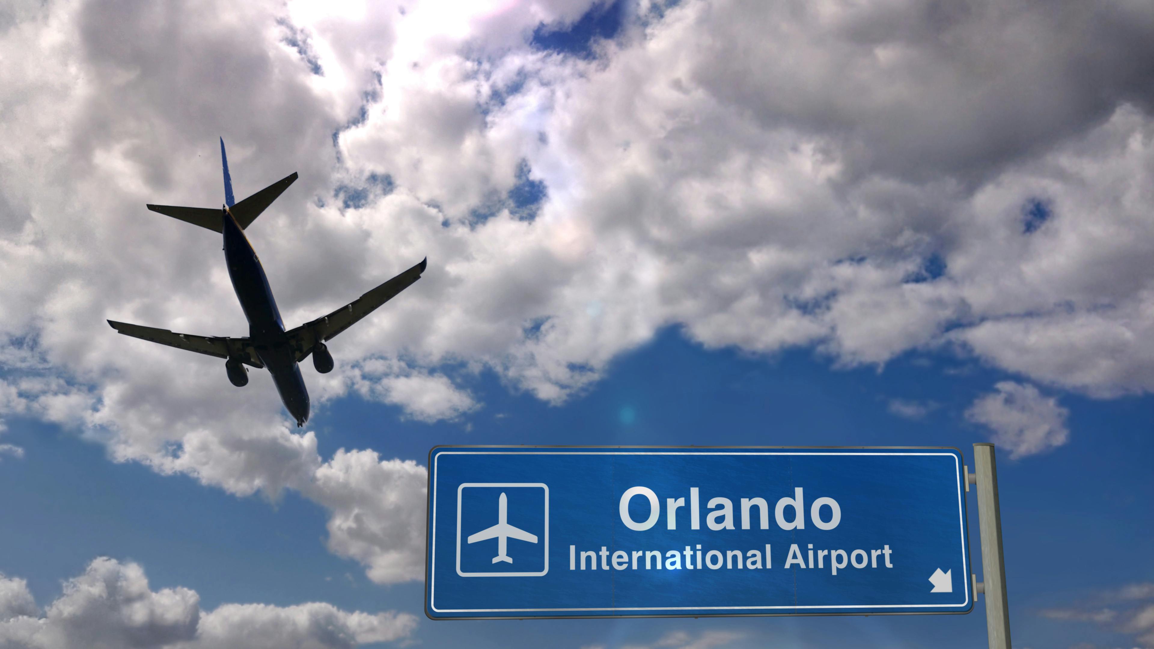 orlando airport motorcycle rentals on riders share, image of plane landing at Orlando airport