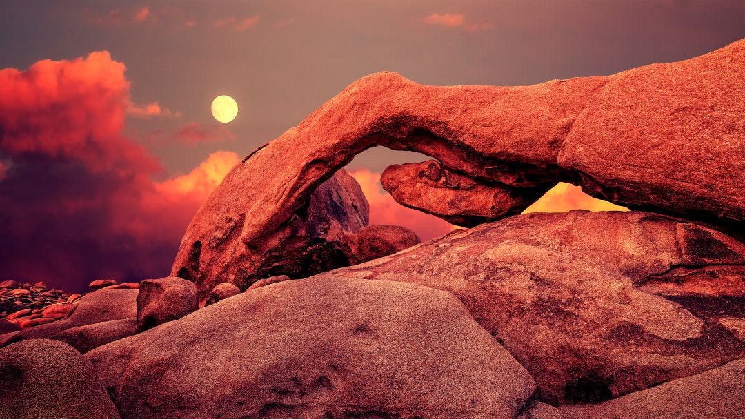 Purple sunset and rising moon in Joshua Tree National Park, USA Best Motorcycle Rides in Palm Springs, California