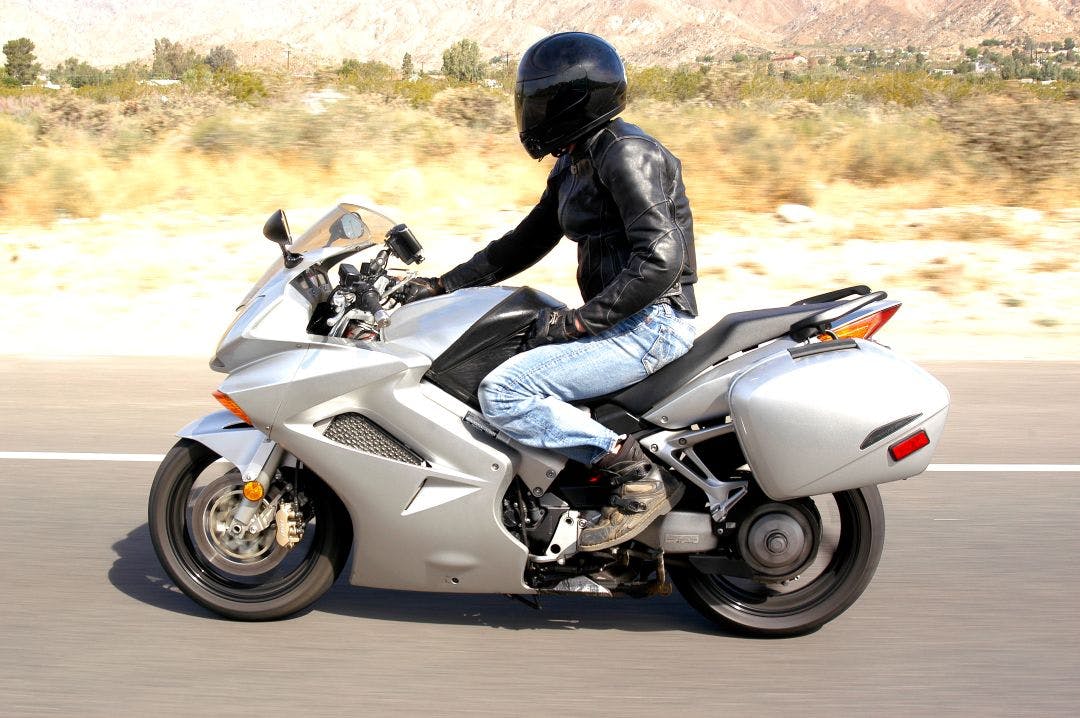 A motorcycle rider on a highway in the desert surrounding Palm Springs, California Motorcycle Clubs near Palm Springs, CA