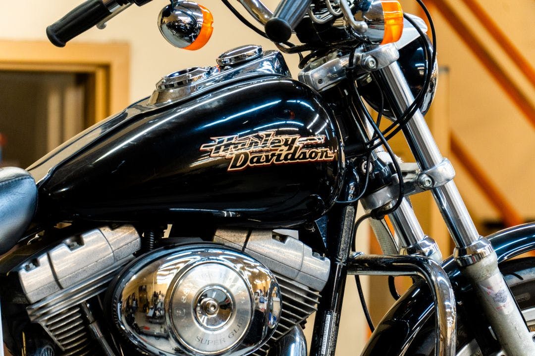 close-up of modern Harley Davidson motorcycles for sale parked in front of the shop of the motorcycle dealer Harley-Davidsons You Can Rent in Houston Right Now