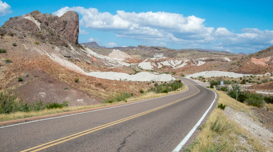 Road through rock formations in Big Bend National Park in Texas Best Scenic Motorcycle Rides in Texas