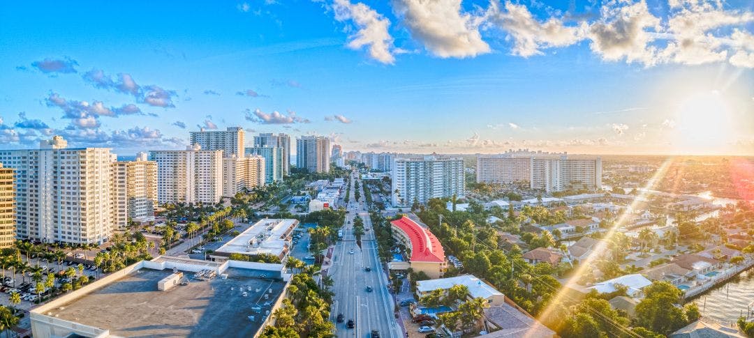 Panoramic aerial drone of city in Fort Lauderdale, Florida with sunset BMW Motorcycle Rentals in Fort Lauderdale - Riders Share