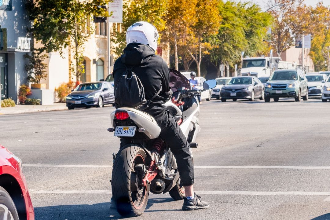 Motorcyclist waiting at a traffic stop What are Georgia's Motorcycle Laws?