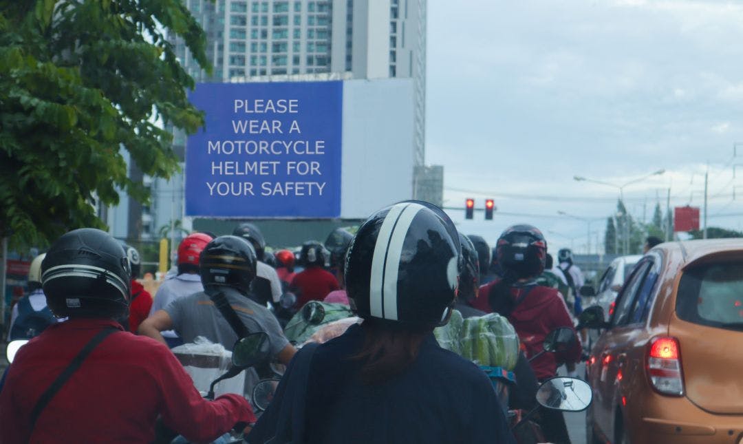 Group of motorbike rider stop at red light and everyone wear helmet for safety. What are Georgia's Motorcycle Laws?
