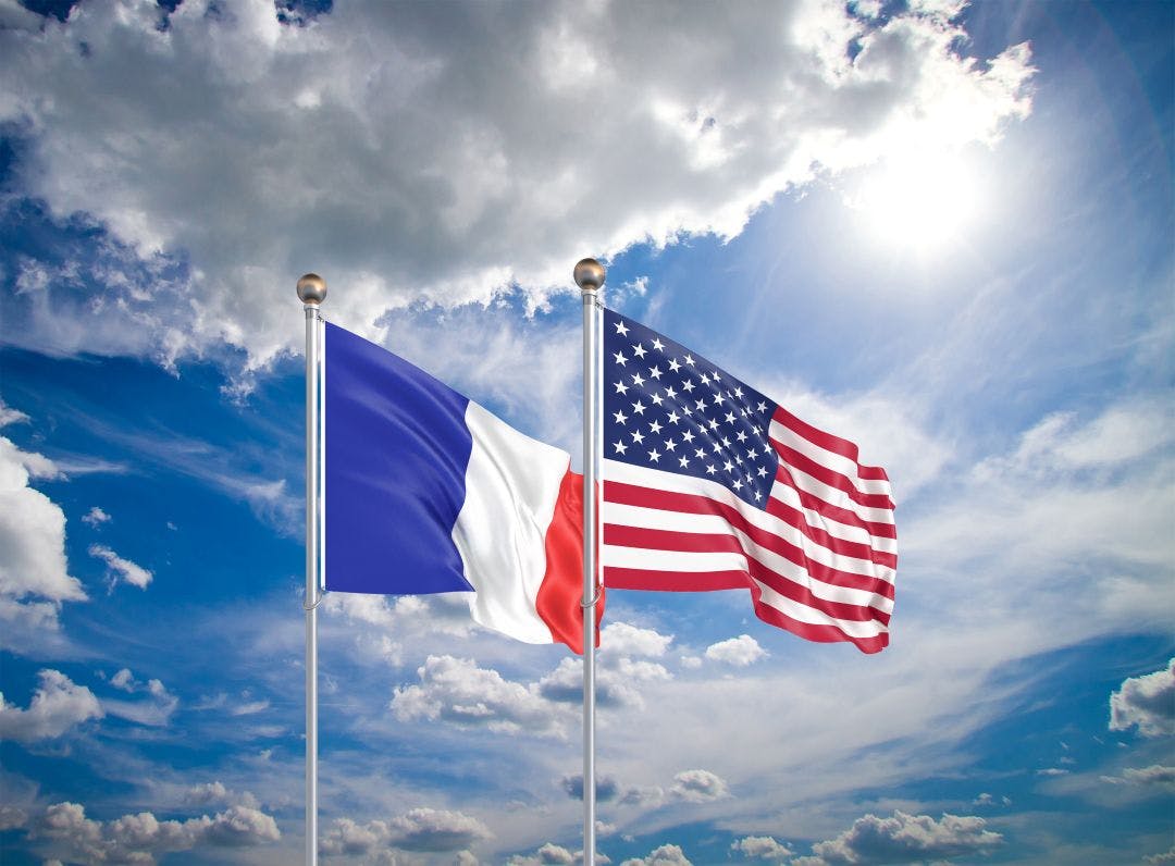 United States of America vs France. Thick colored silky flags of America and France. 3D illustration on sky background French International Motorcycle Driving Permit FAQ to Ride in USA